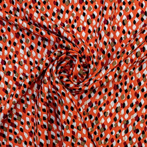 Tissu viscose orange brûlée motif tacheté chally avec fil lurex doré