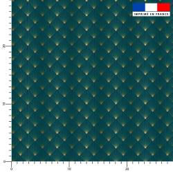 Popeline de coton peigné bleu paon motif écaille triangle dorée