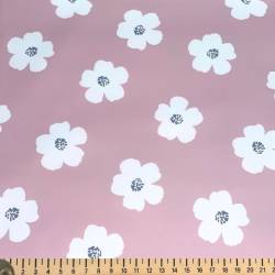 Tissu imperméable type ciré vieux rose motif fleur blanche